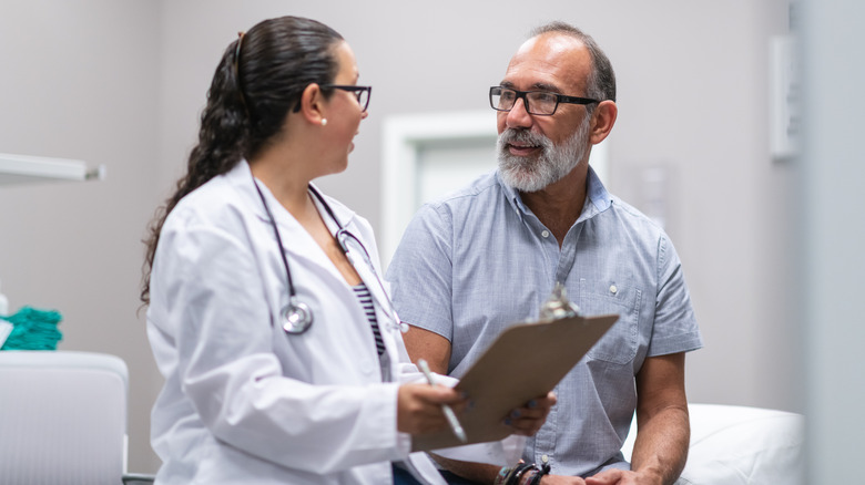 Doctor with male patient