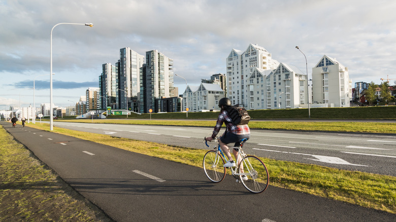 Cyclist takes Reykjavik bike trail.