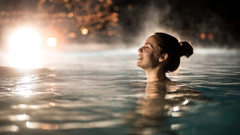 Woman soaks in thermal waters