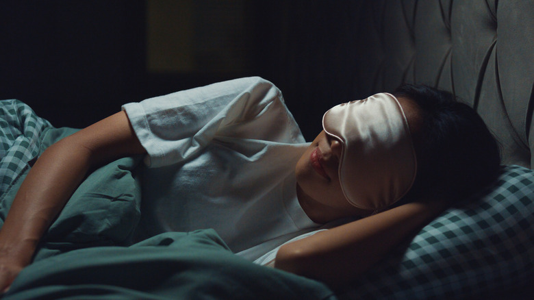 girl sleeping with sleeping mask