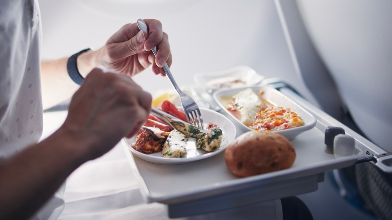 Person eating on tray table