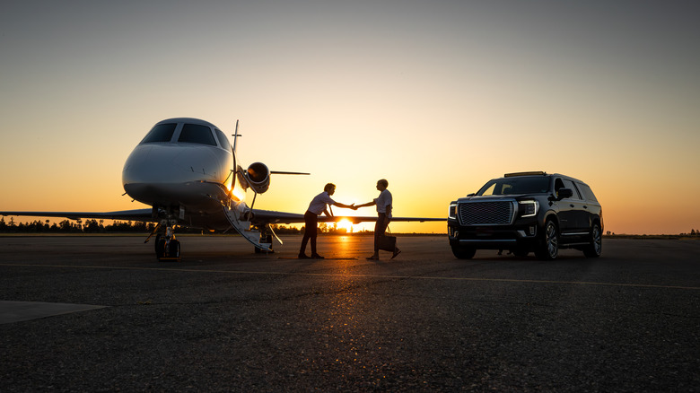 sunset handshake plane and car