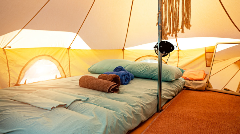 tent with bed made up inside