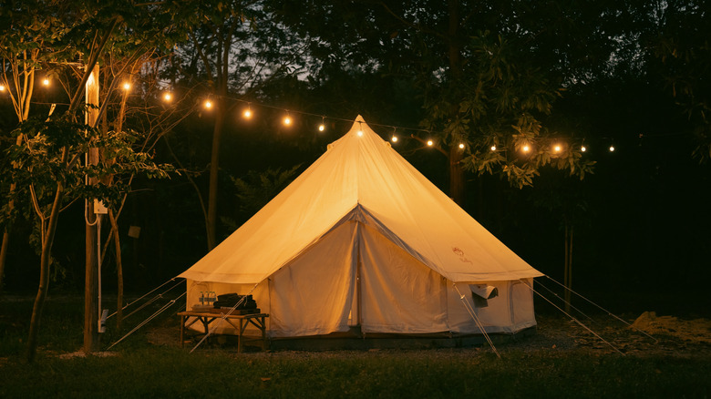 a large bell tent in the evening