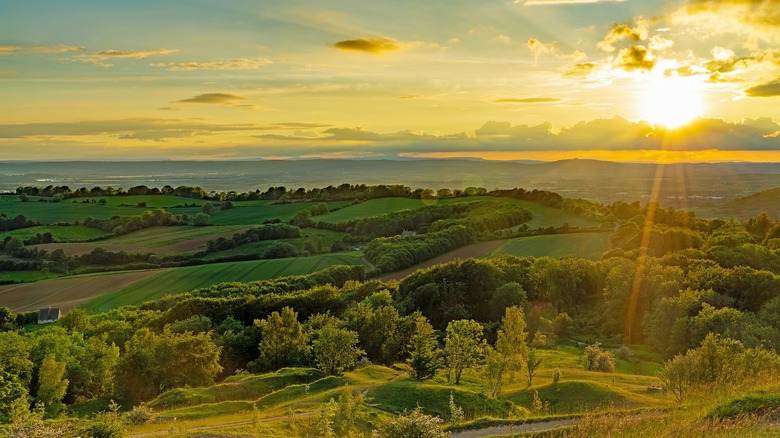 Cotswolds UK rolling landscape sunset