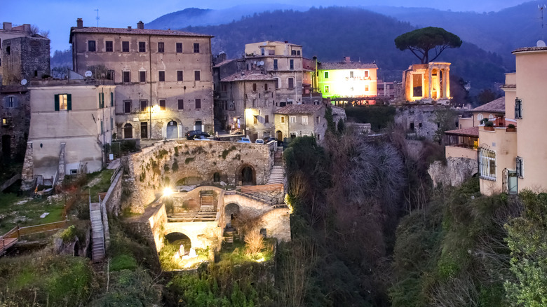 buildings on hills at dusk