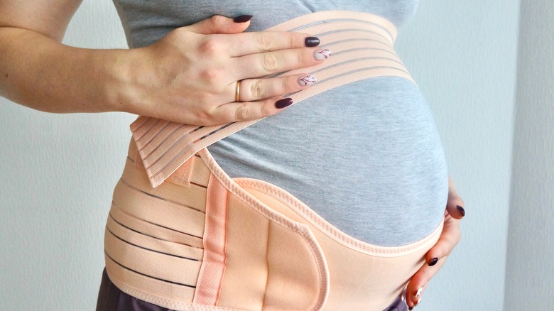 pregnant woman wearing belly band