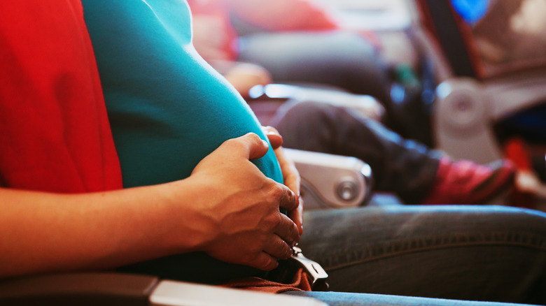 pregnant woman on plane