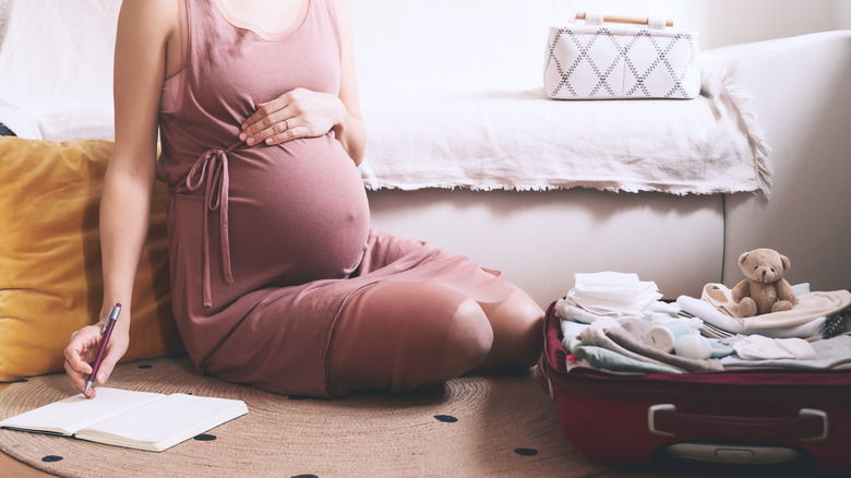 pregnant woman packing for travel