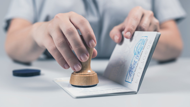 A passport being stamped.