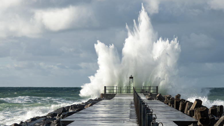 A wave hitting the lighthouse at Norre Vorupør in Denmark