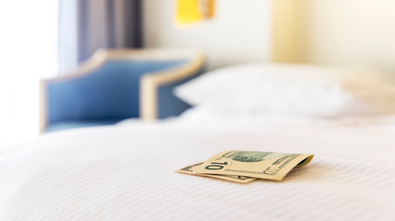 A tip on a hotel bed