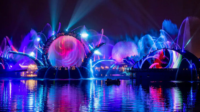 colorful fountains with Spaceship Earth in background