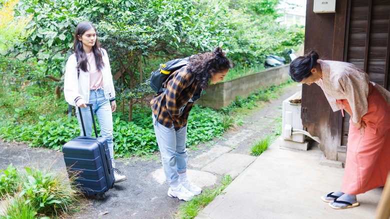 women bowing in Japan