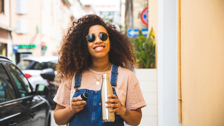 Woman holding a water bottle