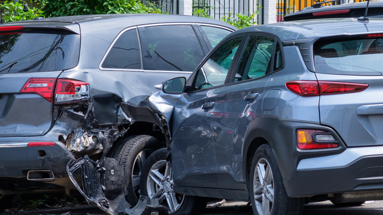 grey SUV crashed into SUV