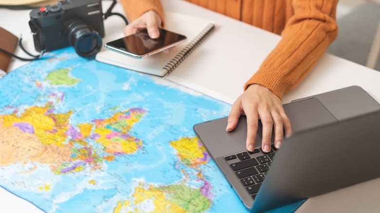 woman with map and computer