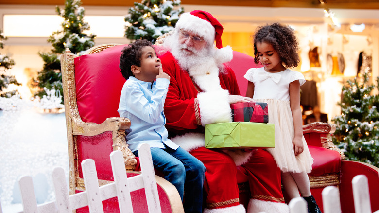 Kids visiting with Santa Claus