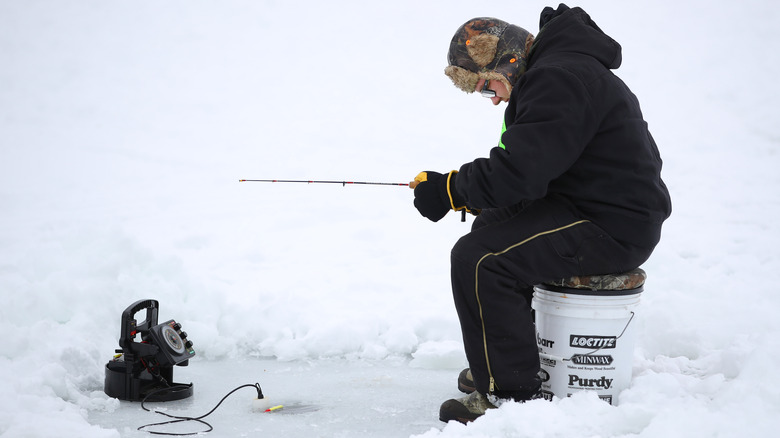 Man ice fishing