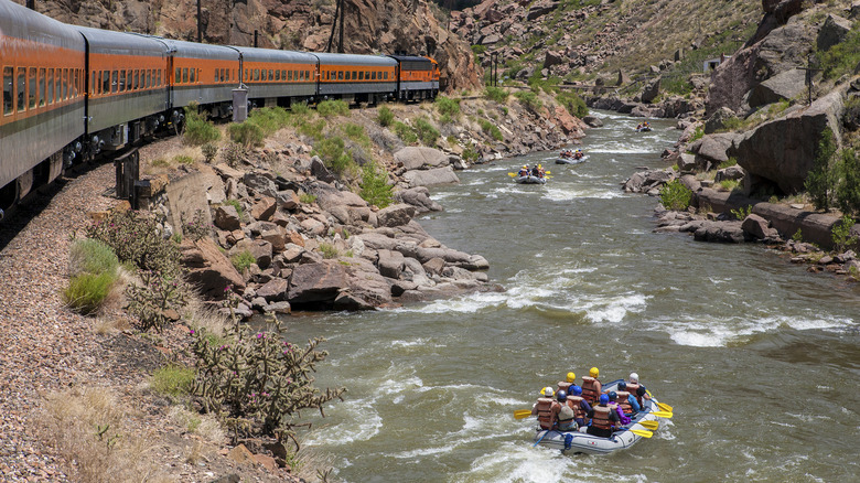 rafters in Royal Gorge, alongside a train