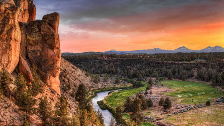 Jagged cliffs and a river at sunset