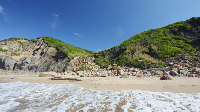 beach below steep cliff