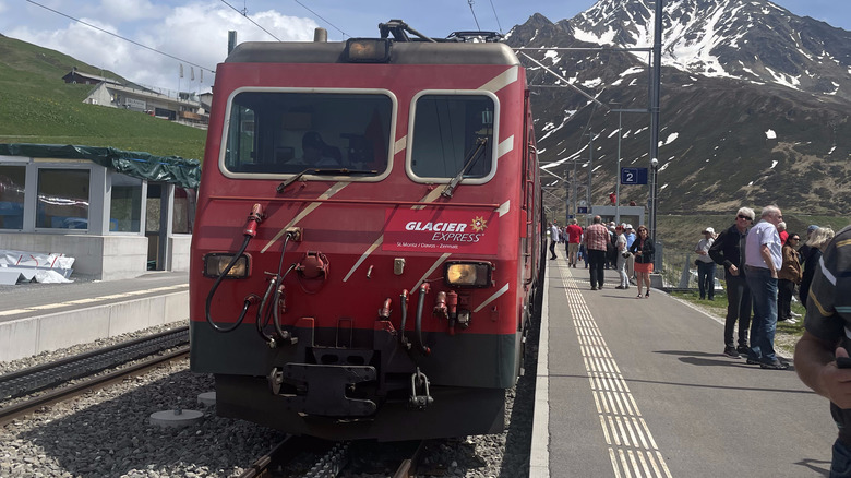 Train parked near mountains