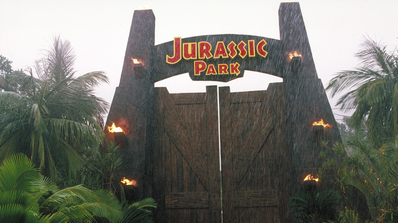 Jurassic Park gate torches lit raining