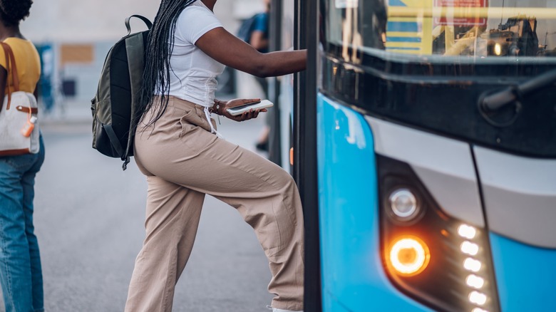 Woman getting on the bus