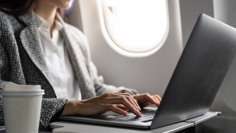 Woman working on a plane