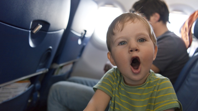 child on airplane