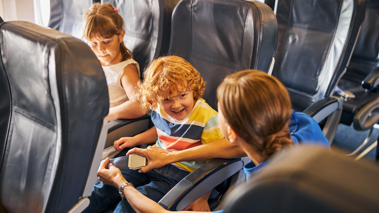 flight attendant talking to kids