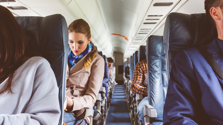 interior or airplane with passengers