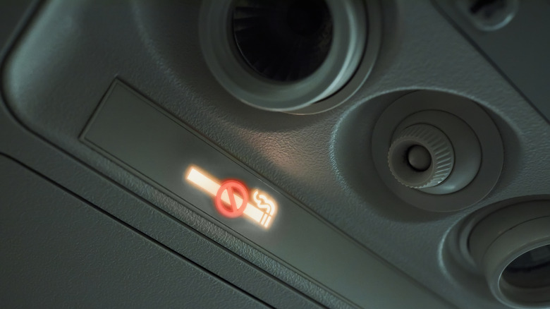 no smoking sign lit up airplane