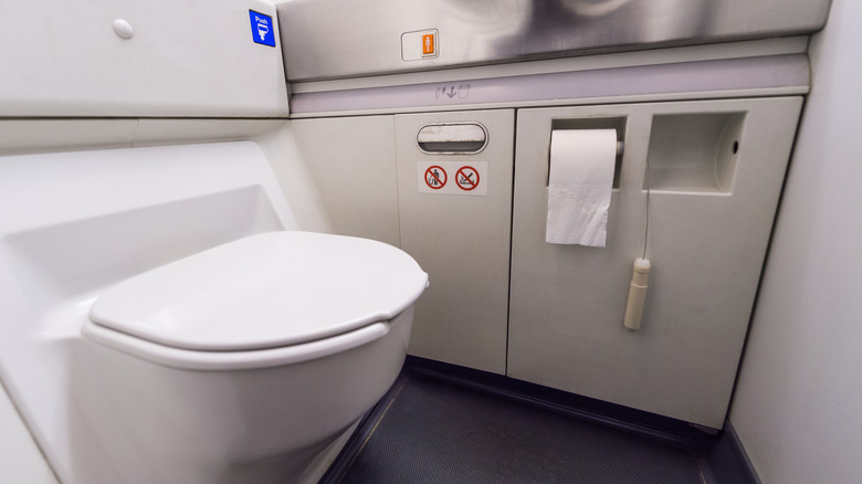 airplane lavatory interior toilet paper