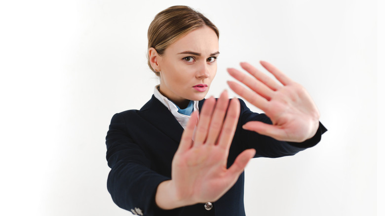 flight attendant with hands up