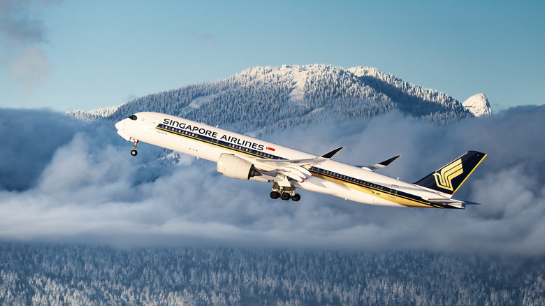Singapore Airlines Airbus A350 flying over mountains