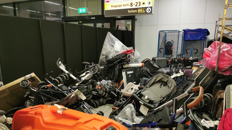 Strollers in baggage claim area