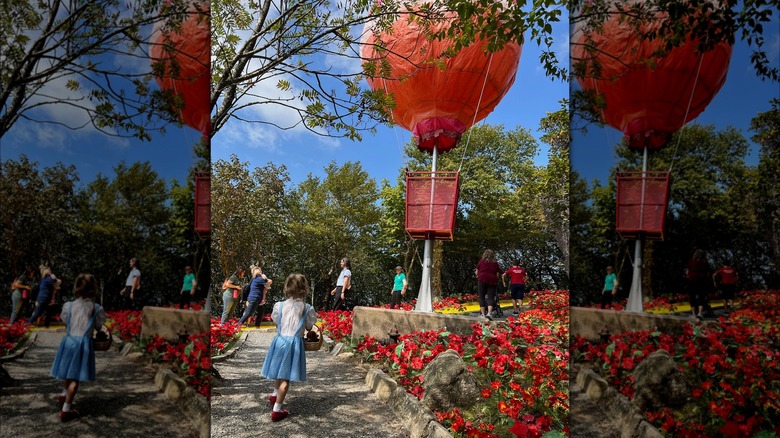 Little girl in Dorothy dress at Land of Oz