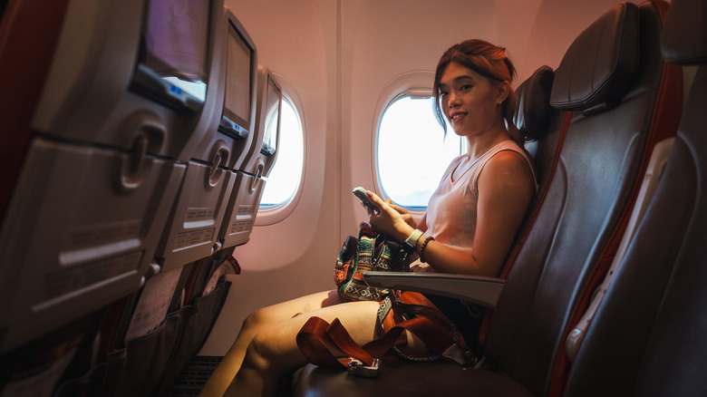 smiling woman on flight