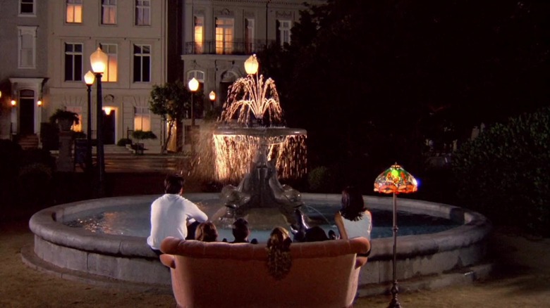 Friends look at fountain