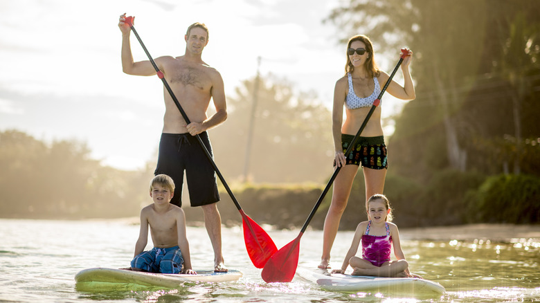 Family paddleboarding in Hawaii