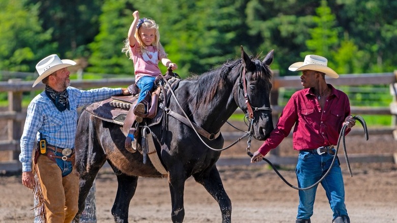 Girl riding a horse 