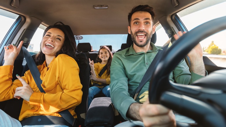 happy family singing in car