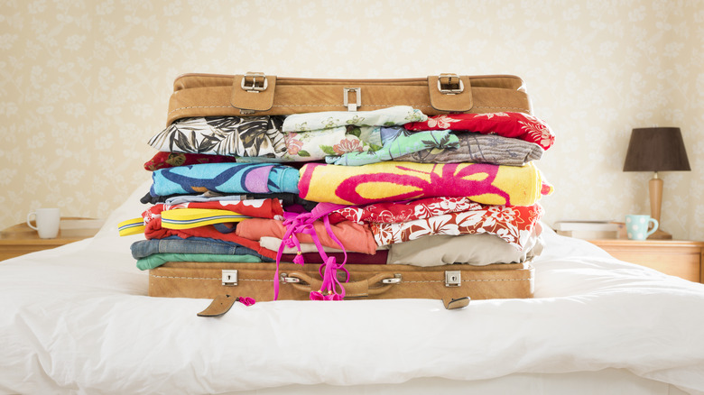 suitcase full of bright clothes