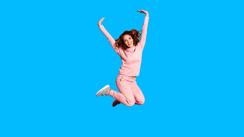 woman jumping in comfortable clothes