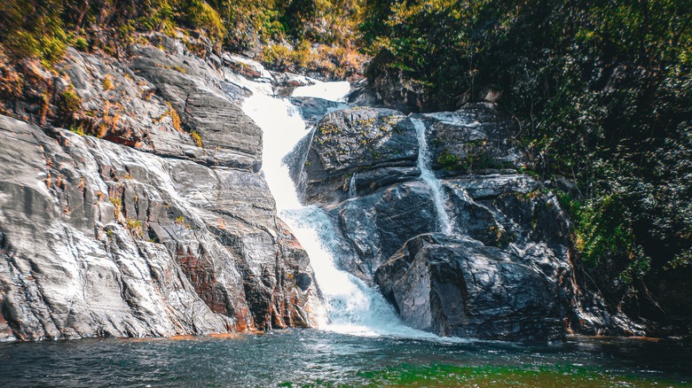 Meenmutty Waterfall flowing over rocks