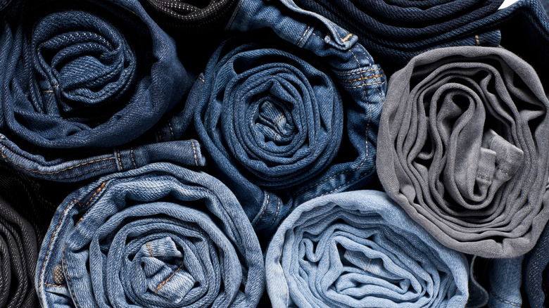 piled of rolled jeans