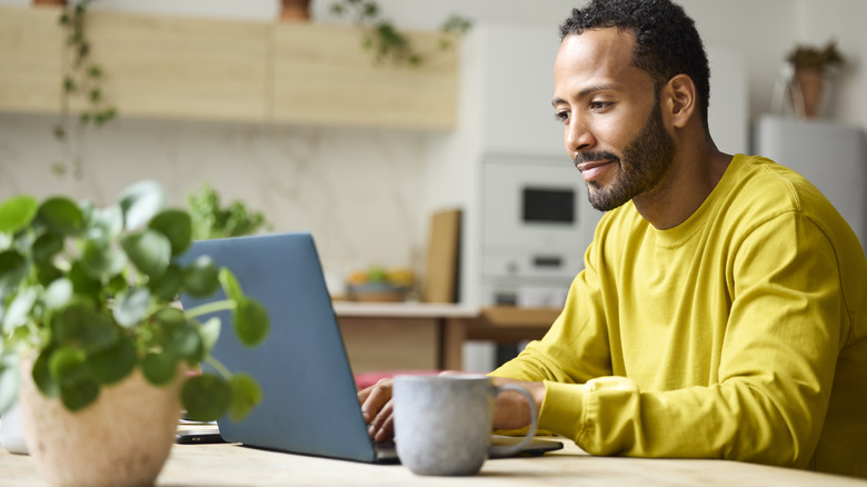 A young person using a laptop.