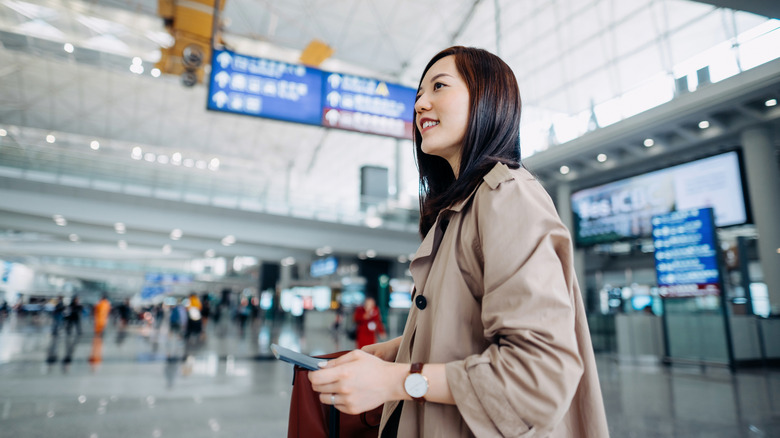 A young traveler in an airport terminal.